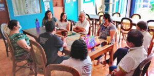 Dee meeting with staff at FUNDAHMER headquarters in San Salvador